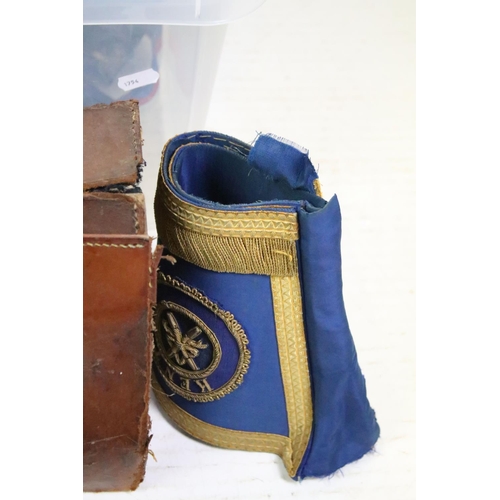 437 - Collection of Masonic items to include aprons, gloves and sashes helped within a leather bag .