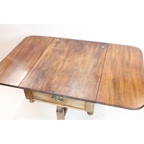 652 - Mahogany Drop Flap Table in the Regency manner with drawer to one end, raised on two supports each w... 