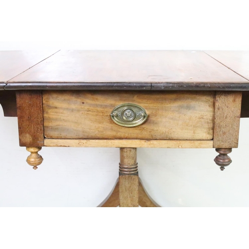 652 - Mahogany Drop Flap Table in the Regency manner with drawer to one end, raised on two supports each w... 