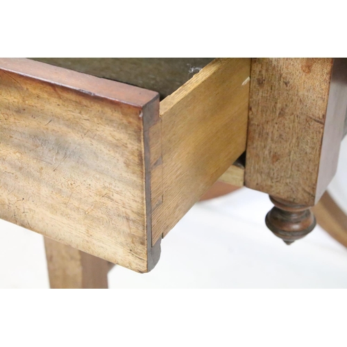 652 - Mahogany Drop Flap Table in the Regency manner with drawer to one end, raised on two supports each w... 