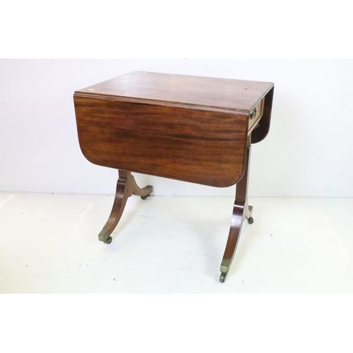 652 - Mahogany Drop Flap Table in the Regency manner with drawer to one end, raised on two supports each w... 