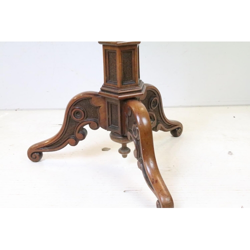 615 - Victorian Mahogany Gothic Revival Octagonal Lamp Table raised on an octagonal column support and thr... 