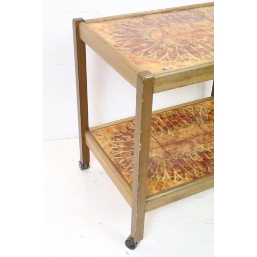 635 - Mid century Retro Two Tier Drinks Trolley, each tier with a tiled surface, 63cm high x 67cm long x 4... 