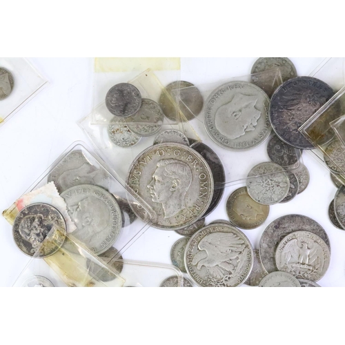 157 - A collection of British pre decimal and world silver coins to include Queen Victoria and King George... 