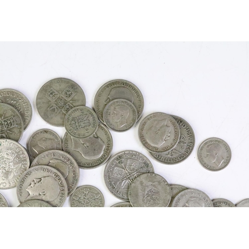 161 - A collection of British pre decimal silver coins to include half crowns, florins shillings and sixpe... 