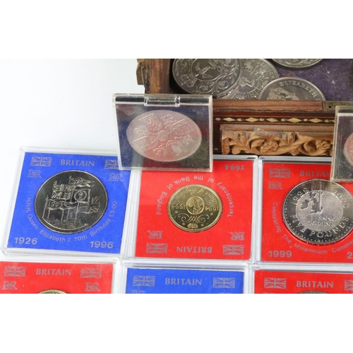 163 - A collection of British commemorative coins to include uncirculated commemorative crowns within caps... 