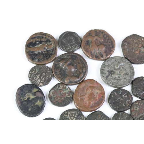 176 - A collection of ancient coins to include Roman examples.