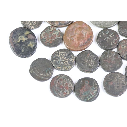 176 - A collection of ancient coins to include Roman examples.