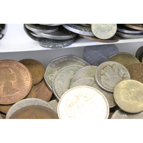 192 - A small collection of British pre decimal and world coins to include some silver examples, along wit... 