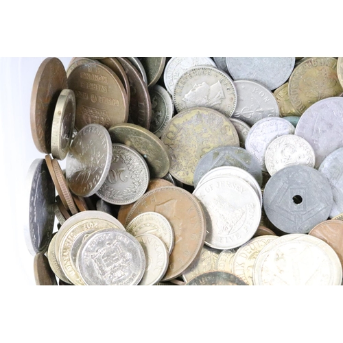 199 - A collection of World coins and banknotes to include early 20th century silver examples.