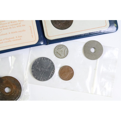 209 - A small collection of British and World coins to include uncirculated and early silver examples.