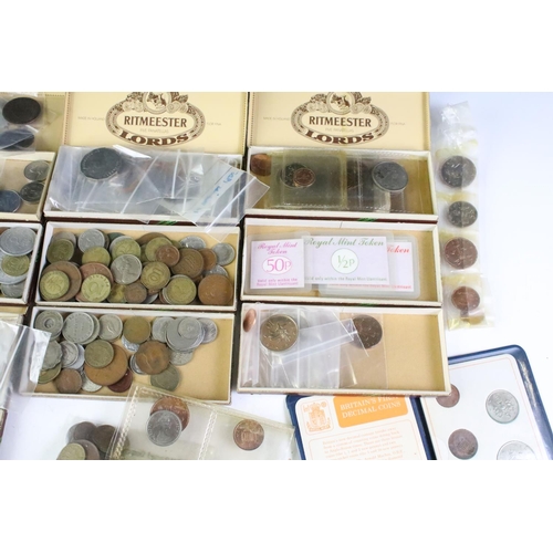 209 - A small collection of British and World coins to include uncirculated and early silver examples.