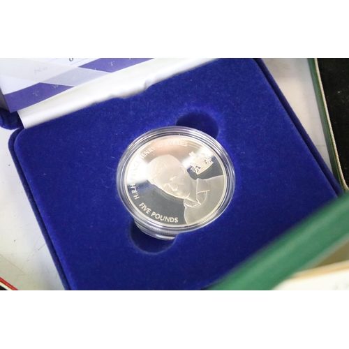 26 - A collection of cased uncirculated and proof coins to include silver proof examples.