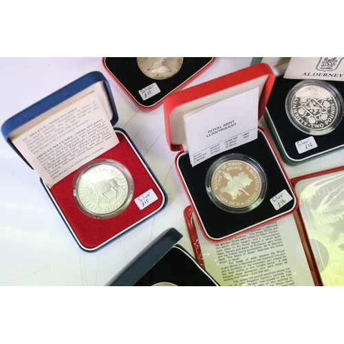 26 - A collection of cased uncirculated and proof coins to include silver proof examples.