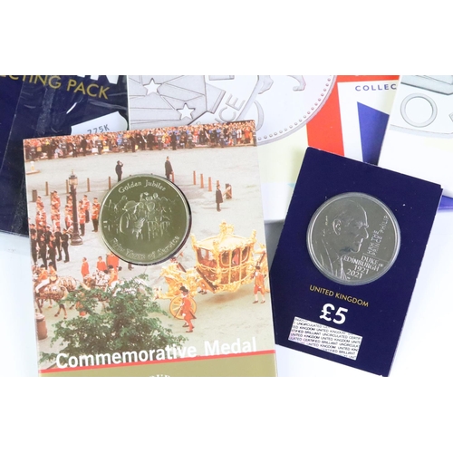 39 - A collection of Royal Mint Uncirculated coin sets to include six year sets, £5 coins, 50p coins and ... 