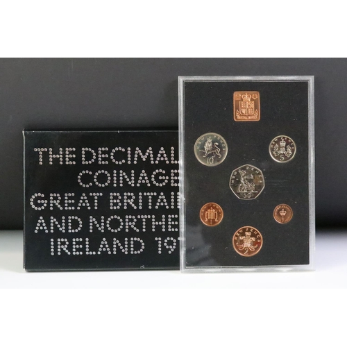 47 - A collection of six Royal Mint brilliant uncirculated coin year sets to include 1971, 1975, 1974, 19... 