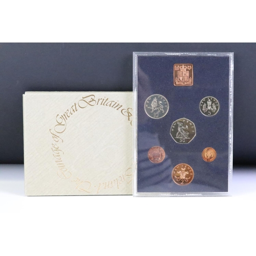 48 - A collection of seven Royal Mint brilliant uncirculated coin year sets to include 1982, 1981, 1980, ... 