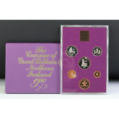 48 - A collection of seven Royal Mint brilliant uncirculated coin year sets to include 1982, 1981, 1980, ... 