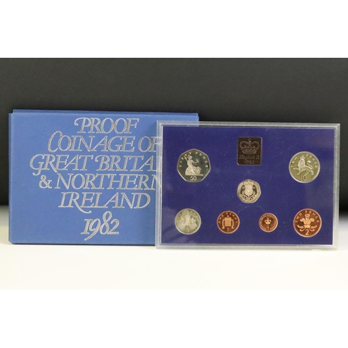 48 - A collection of seven Royal Mint brilliant uncirculated coin year sets to include 1982, 1981, 1980, ... 