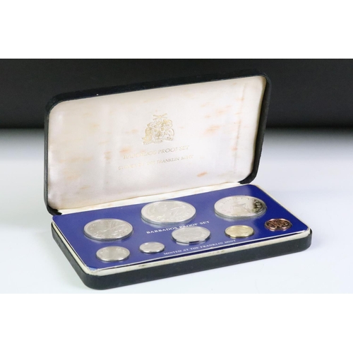 49 - A collection of three Franklin Mint proof coin sets to include The first coinage of Papua New Guinea... 