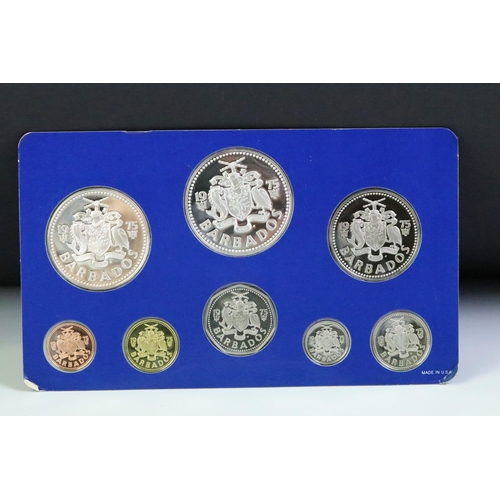 49 - A collection of three Franklin Mint proof coin sets to include The first coinage of Papua New Guinea... 