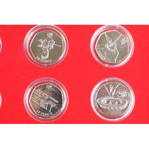 80 - A brilliant uncirculated 2012 olympic games 50p coin set together with the completer medallion, coin... 