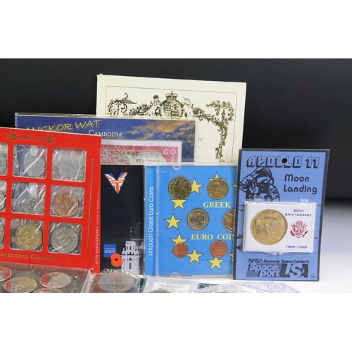 84 - A collection of mixed coins and banknotes to include proof and uncirculated world coin sets, Kenya h... 