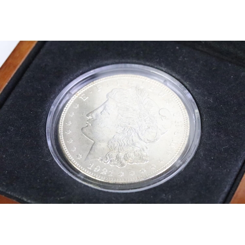 87 - A London Mint 'The Last Ever U.S. Morgan Dollar' together with a slab mounted Silver Eagle dollar, b... 