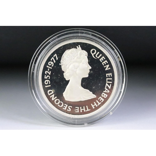 89 - A collection of four Royal Mint silver proof commemorative crowns to include 3 x 1977 silver jubilee... 