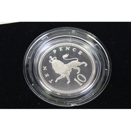 95 - A collection of three silver proof coin sets to include the 1982 silver proof piedfort 20p coin, the... 