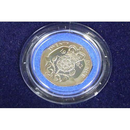 95 - A collection of three silver proof coin sets to include the 1982 silver proof piedfort 20p coin, the... 