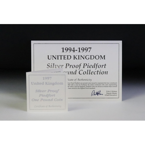 95 - A collection of three silver proof coin sets to include the 1982 silver proof piedfort 20p coin, the... 