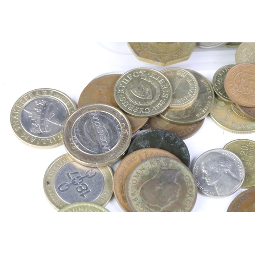 211 - A small collection of British and World coins to include some silver examples and collectable £2 & 5... 