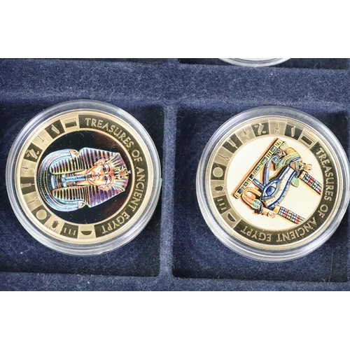 214 - A collection of Egypt commemorative coins encapsulated and within display case together with a selec... 