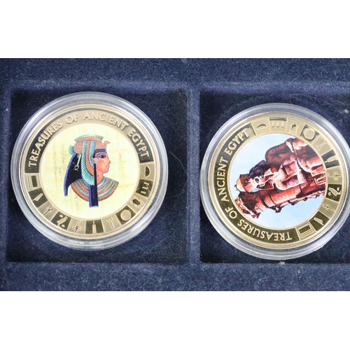 214 - A collection of Egypt commemorative coins encapsulated and within display case together with a selec... 