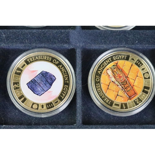 214 - A collection of Egypt commemorative coins encapsulated and within display case together with a selec... 