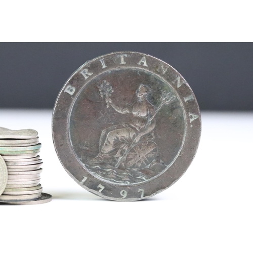 215 - A small collection of British pre decimal coins to include a collection of silver threepence coins a... 