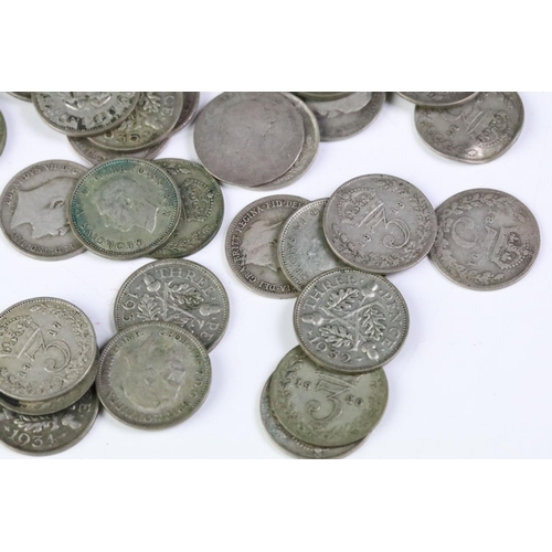 215 - A small collection of British pre decimal coins to include a collection of silver threepence coins a... 