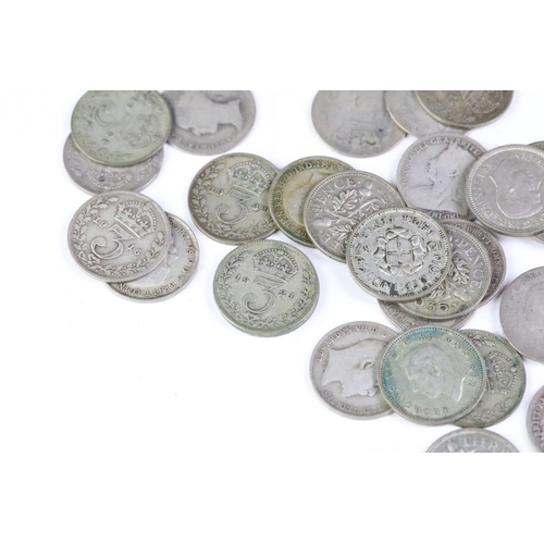 215 - A small collection of British pre decimal coins to include a collection of silver threepence coins a... 