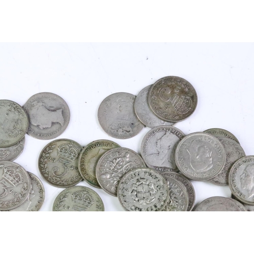 215 - A small collection of British pre decimal coins to include a collection of silver threepence coins a... 