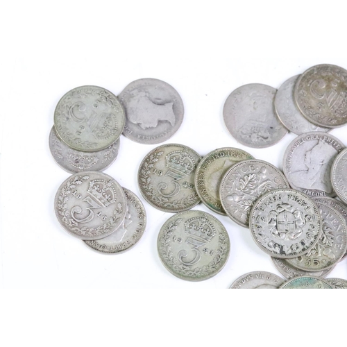 215 - A small collection of British pre decimal coins to include a collection of silver threepence coins a... 