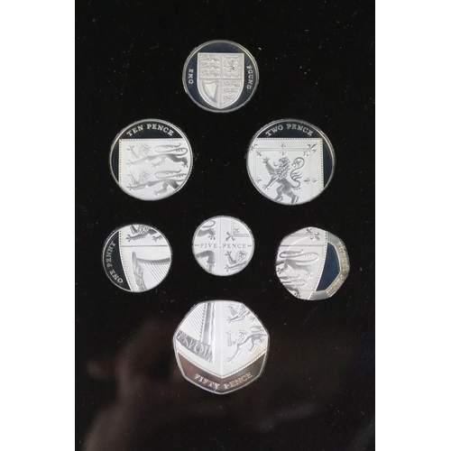 223 - A Royal Mint 2008 United Kingdom Royal Shield of Arms silver proof coin set, encased within leather ... 