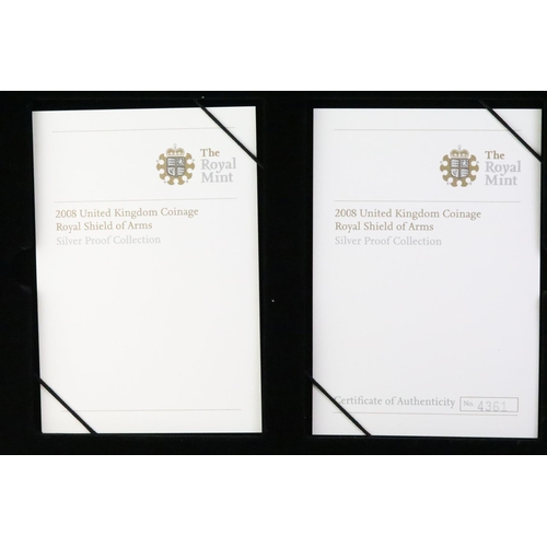 223 - A Royal Mint 2008 United Kingdom Royal Shield of Arms silver proof coin set, encased within leather ... 