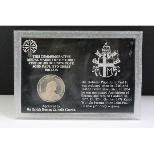 294 - A collection of coins within six plastic display cases to include pre decimal silver crowns.