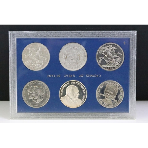 294 - A collection of coins within six plastic display cases to include pre decimal silver crowns.