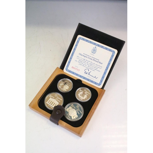 18 - A collection of seven Canada silver proof Olympic coin sets, all within fitted display boxes and com... 