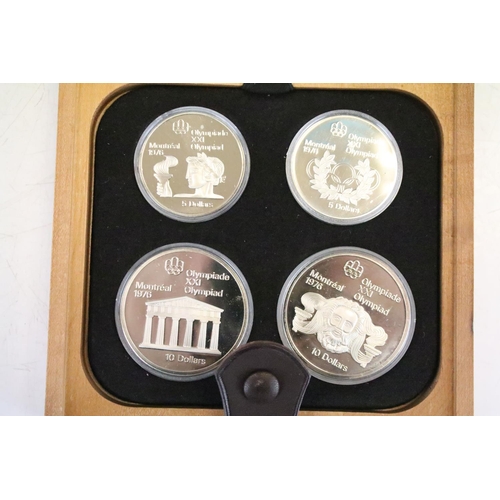 18 - A collection of seven Canada silver proof Olympic coin sets, all within fitted display boxes and com... 