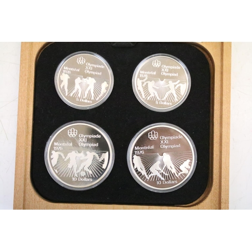 18 - A collection of seven Canada silver proof Olympic coin sets, all within fitted display boxes and com... 