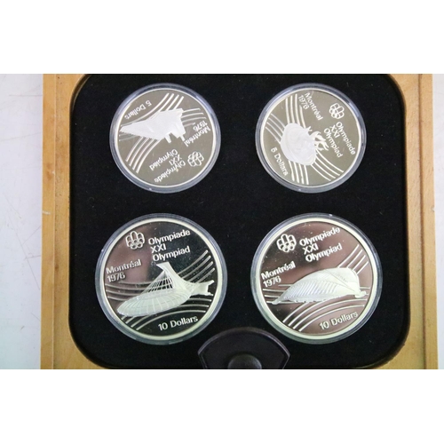 18 - A collection of seven Canada silver proof Olympic coin sets, all within fitted display boxes and com... 