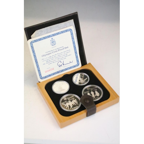 18 - A collection of seven Canada silver proof Olympic coin sets, all within fitted display boxes and com... 